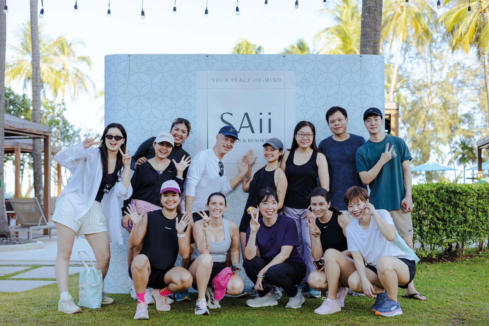 While contemplating if she should start training for the Phuket Marathon, the writer (front, first from right) put on her bravest smile for the camera (Credit: SAii Hotels & Resorts)