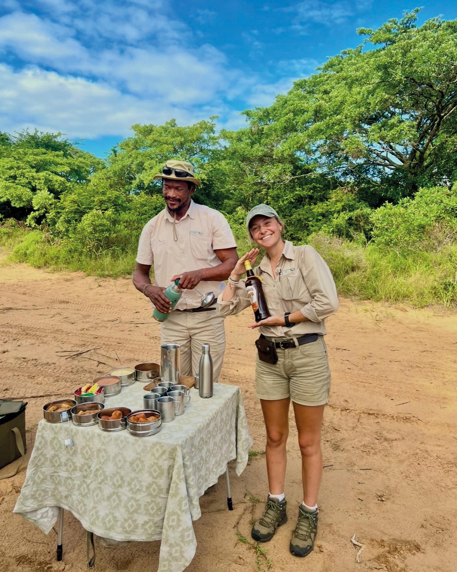 Toks Mlambo and Jess Botha prepare drinks for guests at a picnic (Credit: Mavis Teo)