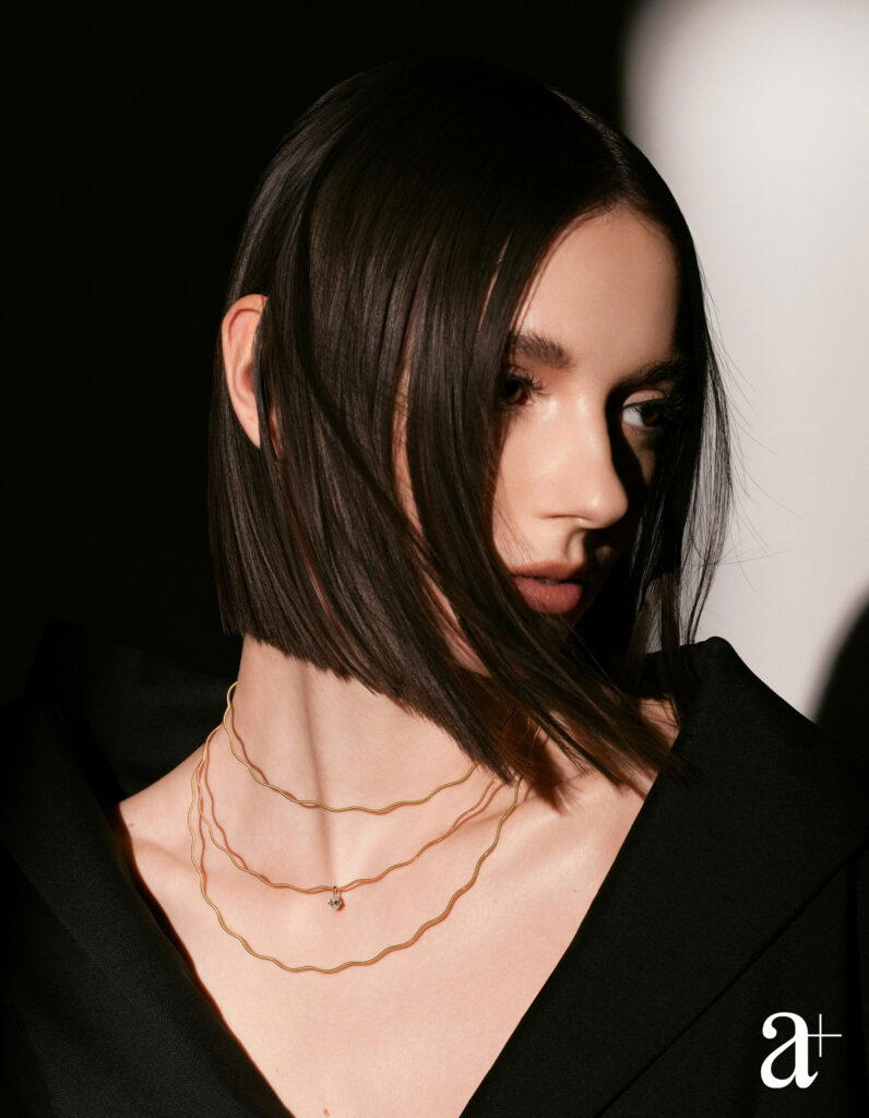 Niessing Coil Wave necklace in Classic Red and Classic Yellow gold, Niessing Amatis Pear pendant in Classic Red gold (Credit: Stefan Khoo)