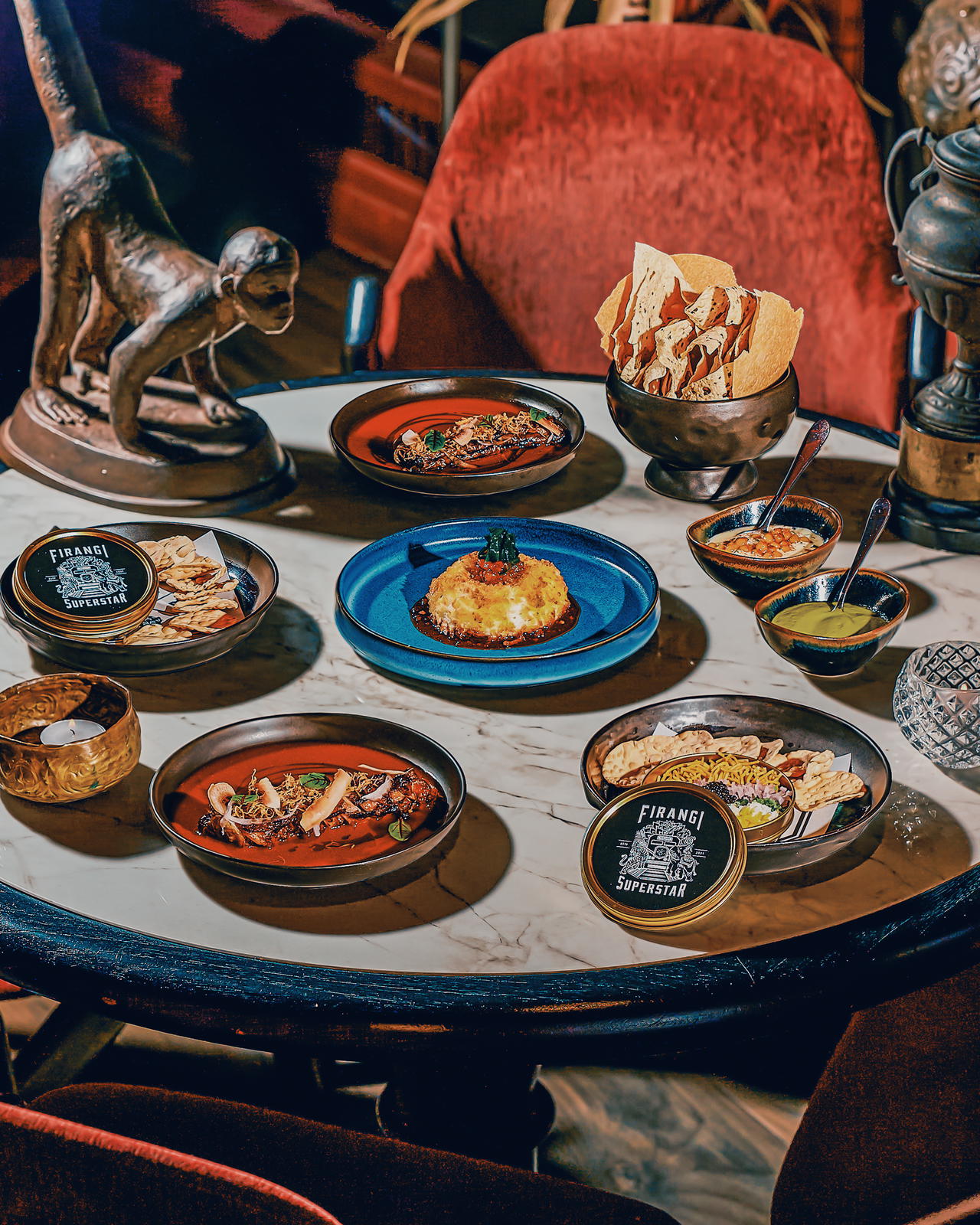 New menu items include Nut Kraken, Big Baller, Papi's Jammed Gun, and Papads with chutneys (Credit: Firangi Superstar)