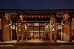 The original timber beams and intricate carvings accentuate the main hall with a touch of history (Credit: Bar Kap)