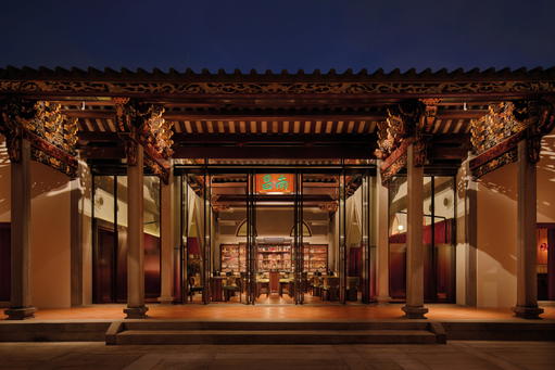 The original timber beams and intricate carvings accentuate the main hall with a touch of history (Credit: Bar Kap)
