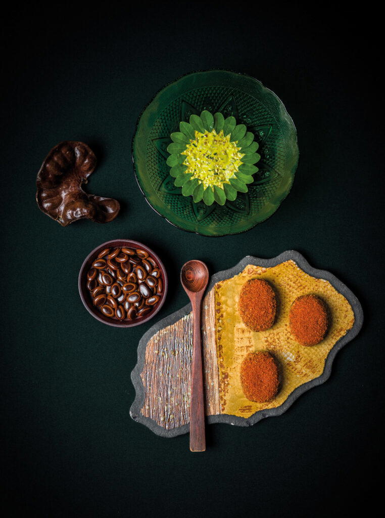 and Bunuelos De Orejero (candied duck fritters with cured and smoked duck tartar, moringa mayonnaise, and hoisin) (Credit: Celele)
