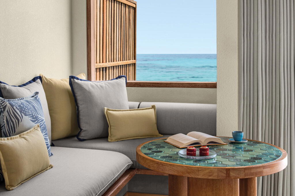 One way to spend time here: reading while listening to the waves crash (Credit: NH Collection Maldives Reethi Resort)