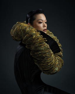 Ida Ng, CEO of Helu-Trans Group, models a piece from the 2026 ‘Malai’ Series (Credit: Punsiri Siriwetchapun)