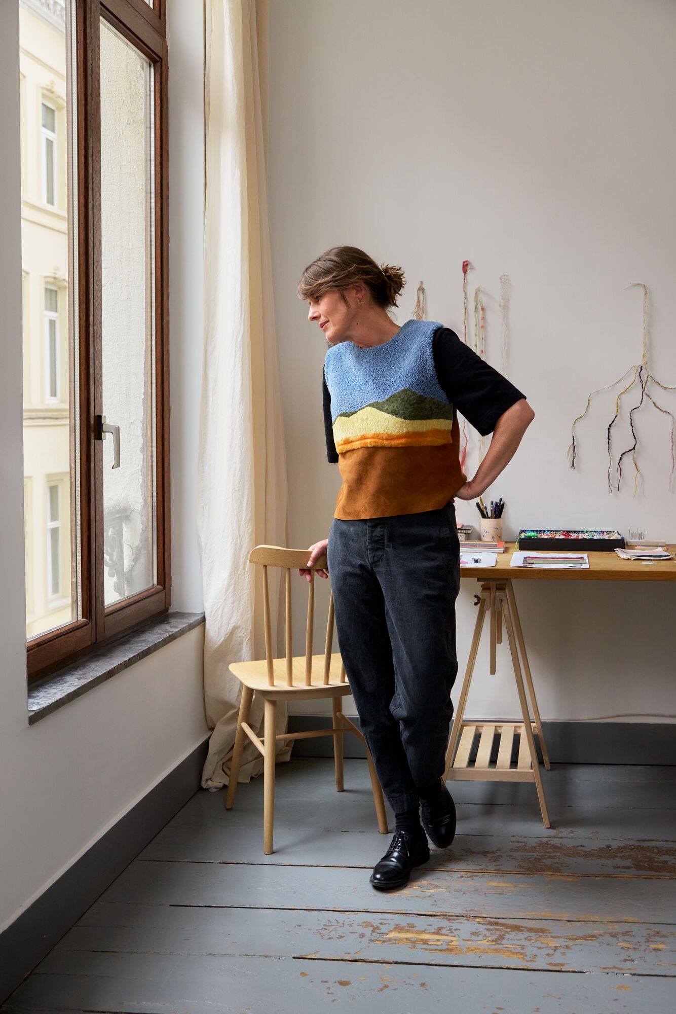 Hélain in the studio wearing a vest from her collaboration with Longchamp (Credit: Longchamp)