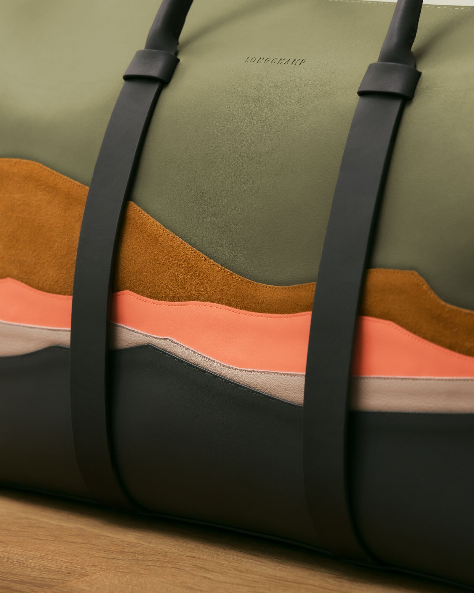 A close-up look at the intricate leather marquetry on a travel bag (Credit: Longchamp)