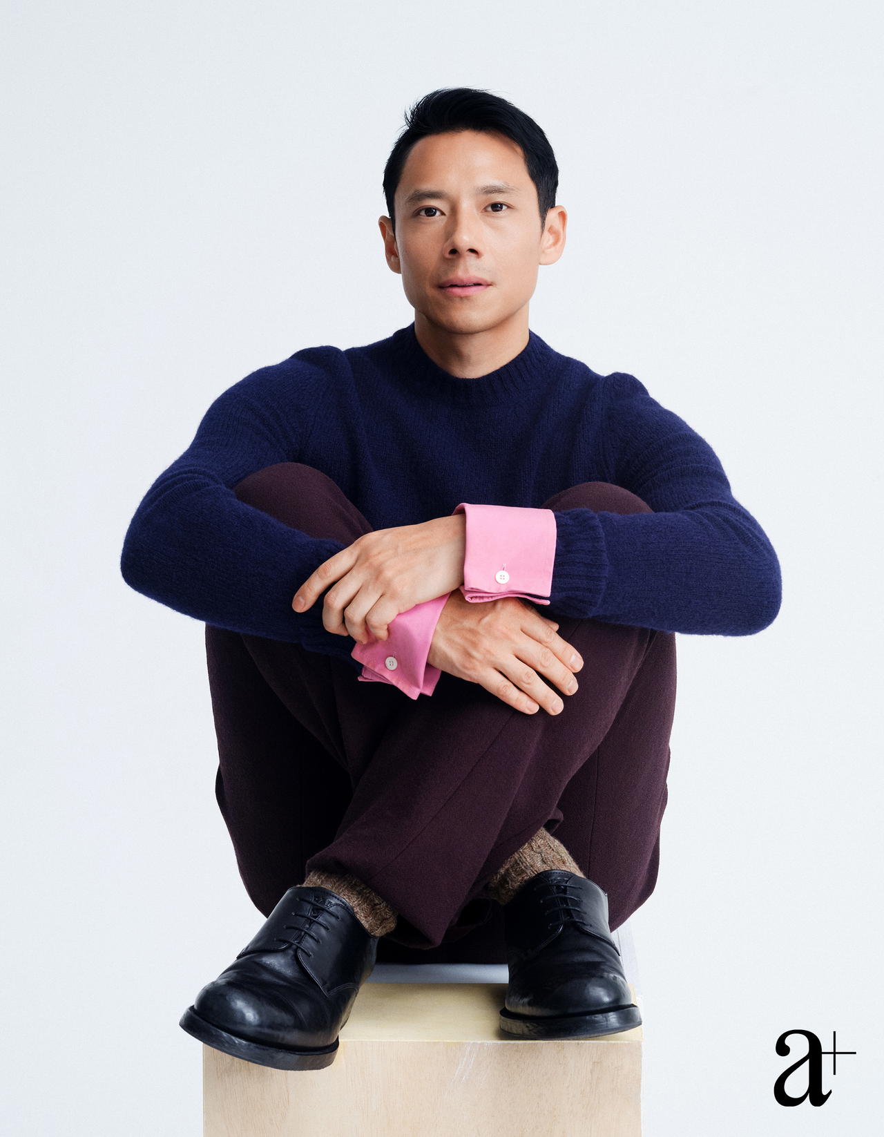 Wool sweater with detachable cuffs, wool trousers, and distressed calfskin lace-ups, all from Prada (Credit: Stefan Khoo. )