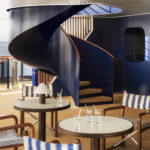 The sleek outdoor deck aboard Orient Express<em> Corinthian</em> blends contemporary yacht design with Belle Époque elegance (Credit: Alice Mesguich)