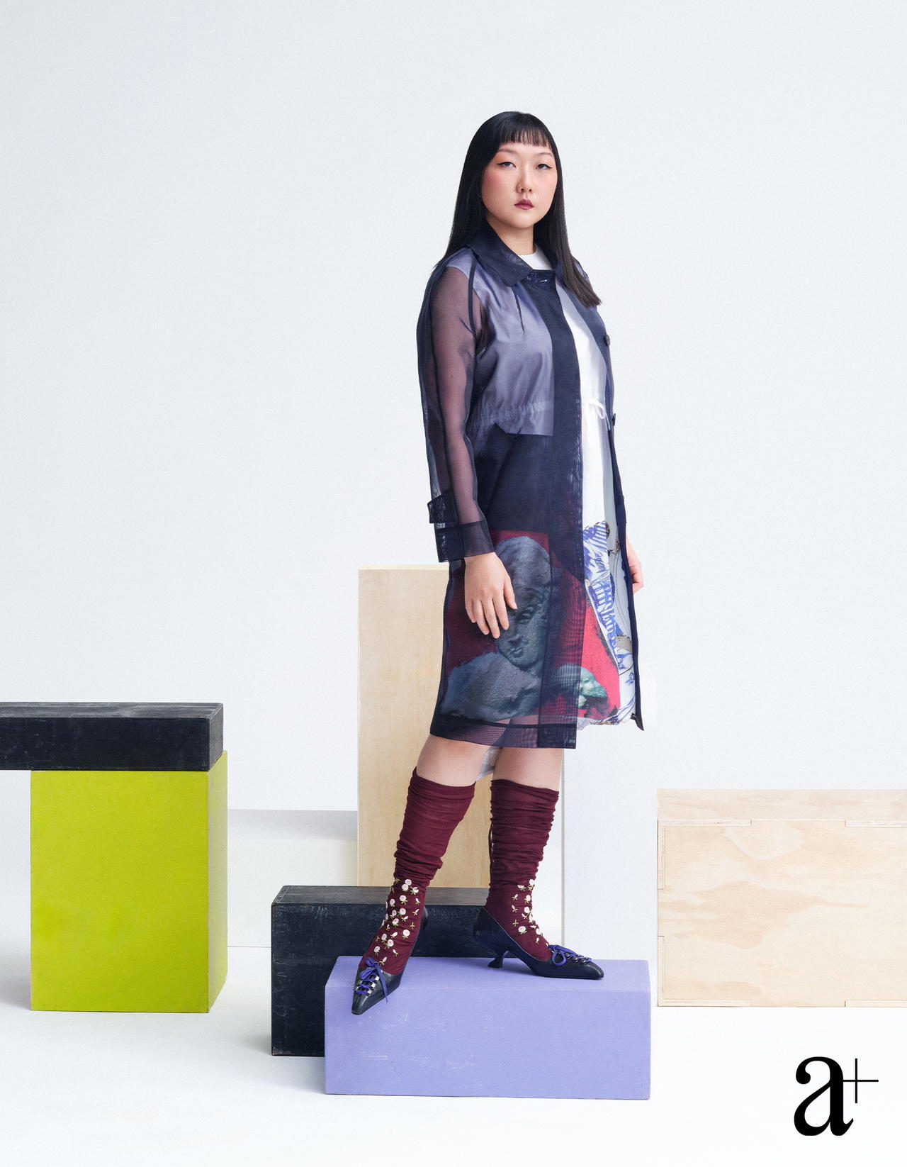 Cotton dress, nylon mesh coat, embroidered socks, and calfskin mules, all from Prada (Credit: Stefan Khoo)