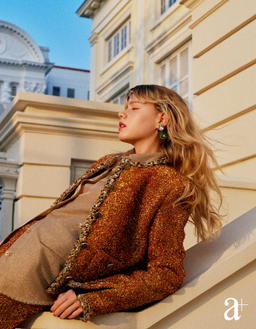 Lurex tweed jacket and matching skirt, metallic twill shirt, and metal and crystal earrings, all from Chanel (Credit: Stefan Khoo)