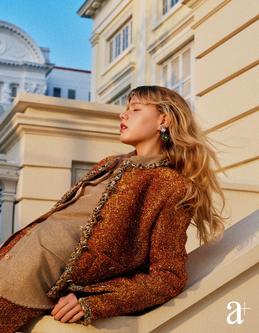 Lurex tweed jacket and matching skirt, metallic twill shirt, and metal and crystal earrings, all from Chanel (Credit: Stefan Khoo)