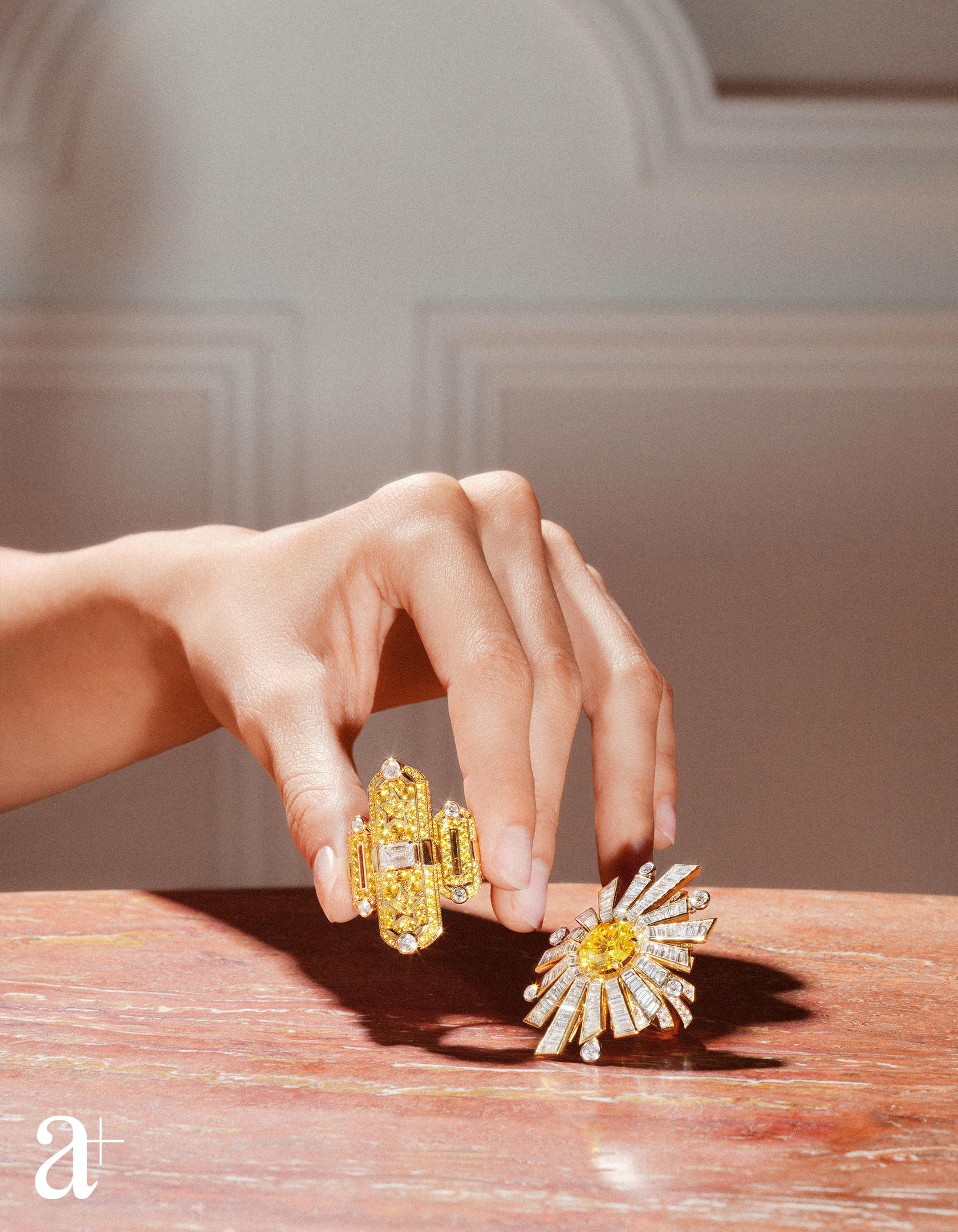 Talisman Graphique ring in yellow gold and platinum with diamonds and yellow sapphires and Soleil 19 Aout ring in yellow gold and platinum with diamonds and a yellow diamond, both from Chanel High Jewellery (Credit: Stefan Khoo)