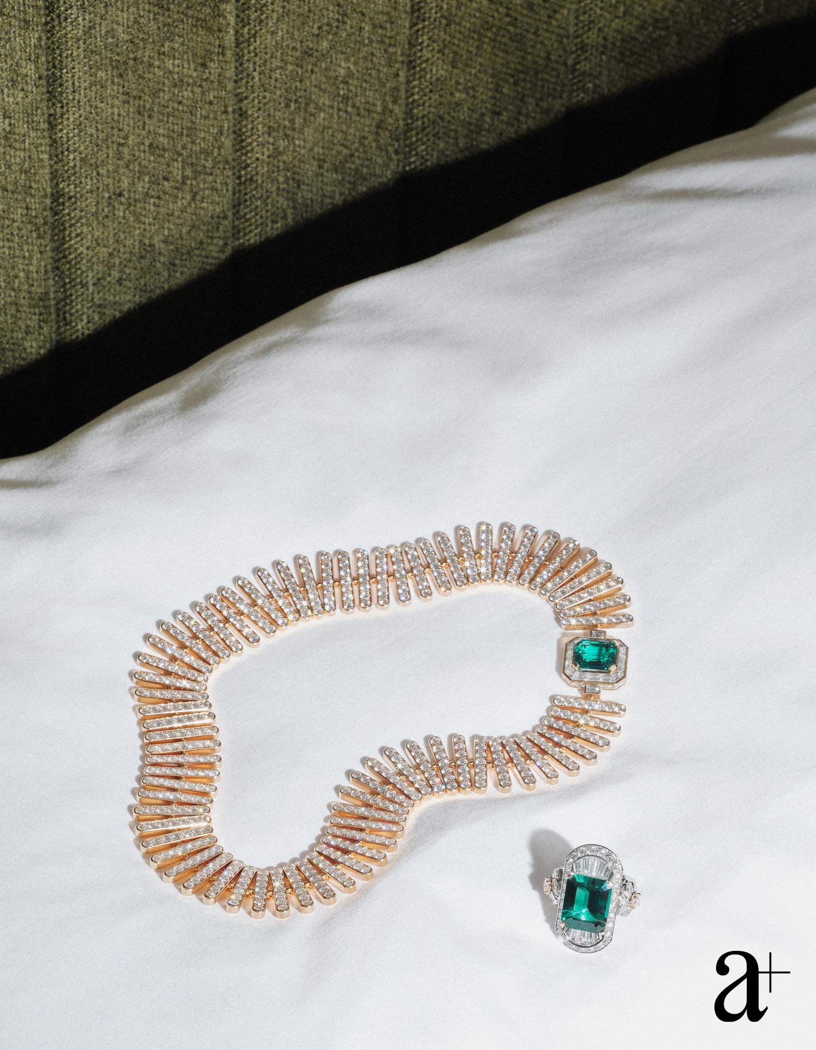Imprime Emeraude ring in white and rose gold with diamonds and a 10.44 ct emerald and Lion magistral necklace in rose gold, platinum, yellow gold, with diamonds and emeralds, both from Chanel High Jewellery (Credit: Stefan Khoo)