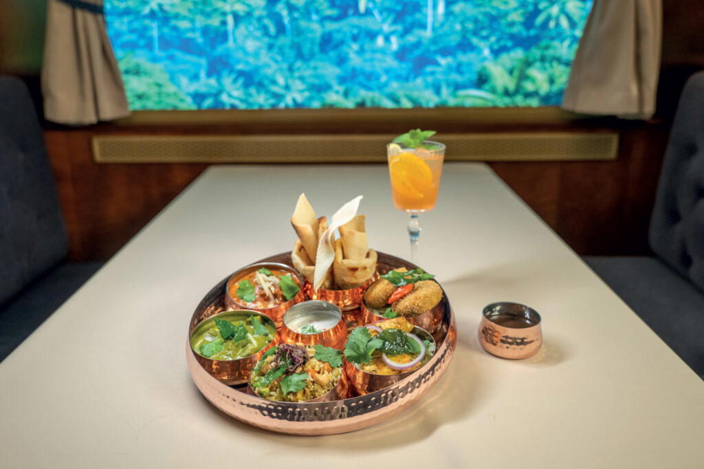 Enjoy Indian-inspired bites such as potato chop, butter chicken, and palak paneer at Royal Railway – Legend Station (Credit: Royal Caribbean)