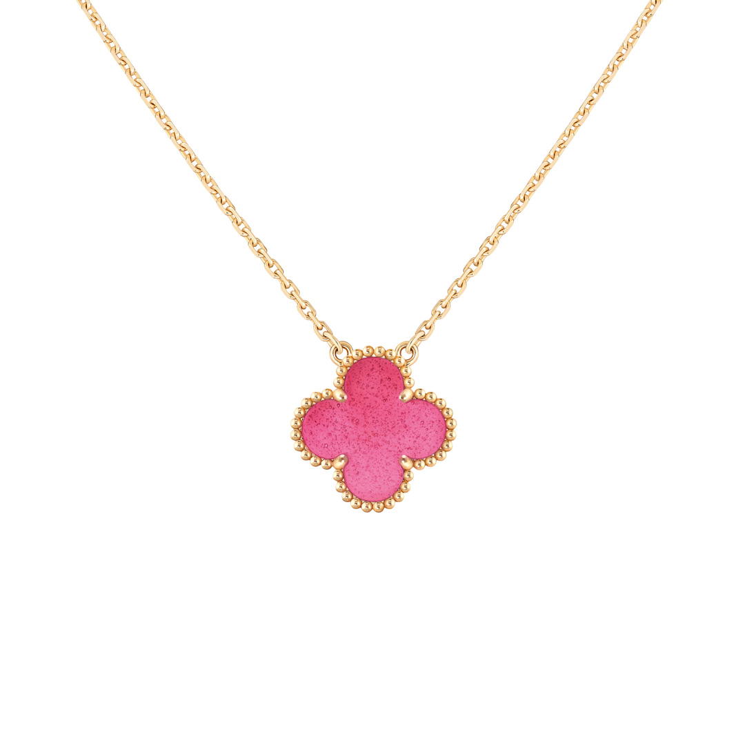 Vintage Alhambra pendant in yellow gold with pink enamel (Credit: Van Cleef & Arpels)