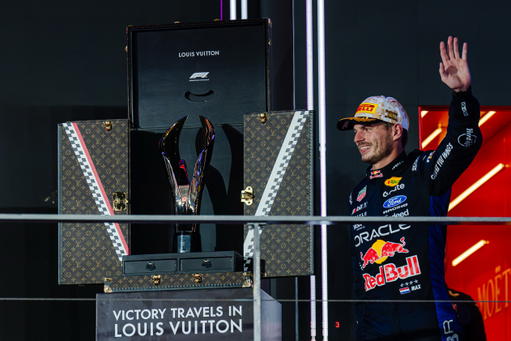 Max Verstappen of Oracle Red Bull Racing celebrates his victory alongside the Louis Vuitton Trophy Trunk on the podium following the Formula 1 Singapore Airlines Singapore Grand Prix 2026 at the Marina Bay Street Circuit in Singapore (Credit: Tan Jun Da)