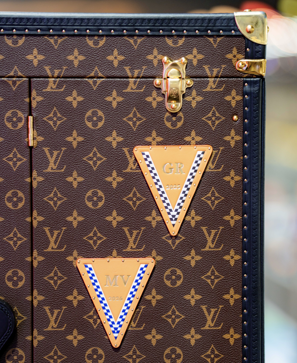 Winner Initials (George Russell (2025) and Max Verstappen (2026) (Credit: Louis Vuitton)